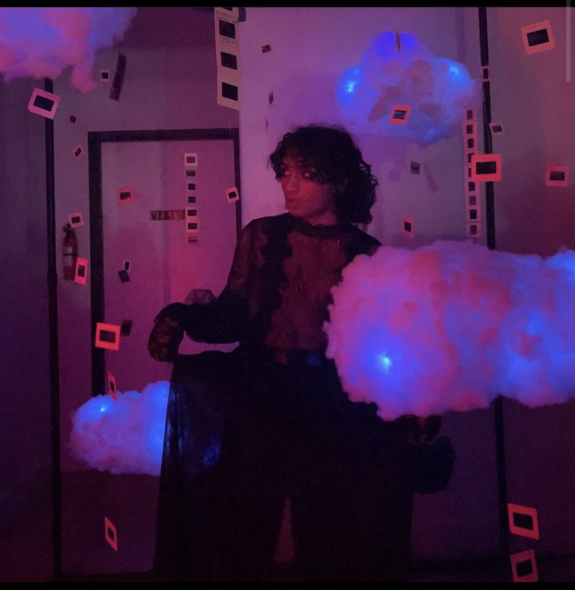 Model inside the glowing cloud and slide sculpture
