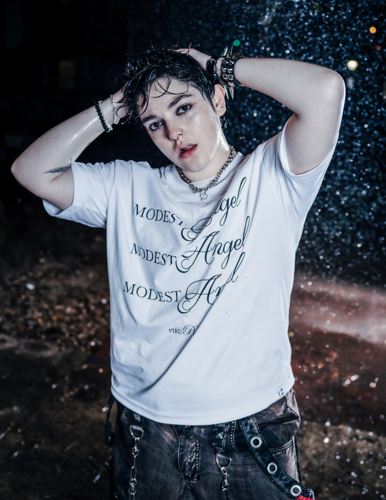 Modest Angel campaign, model in water spray at night