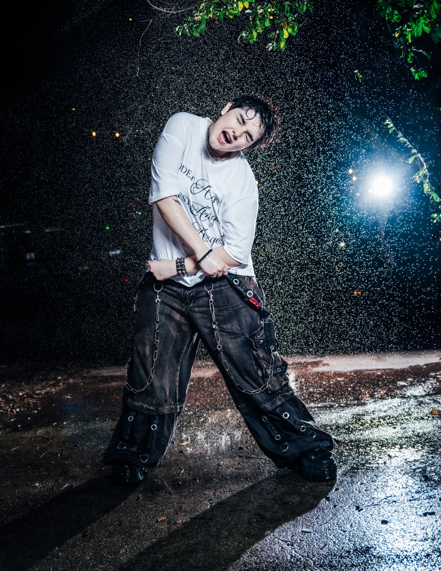 Modest Angel campaign, model mid-motion under falling water
