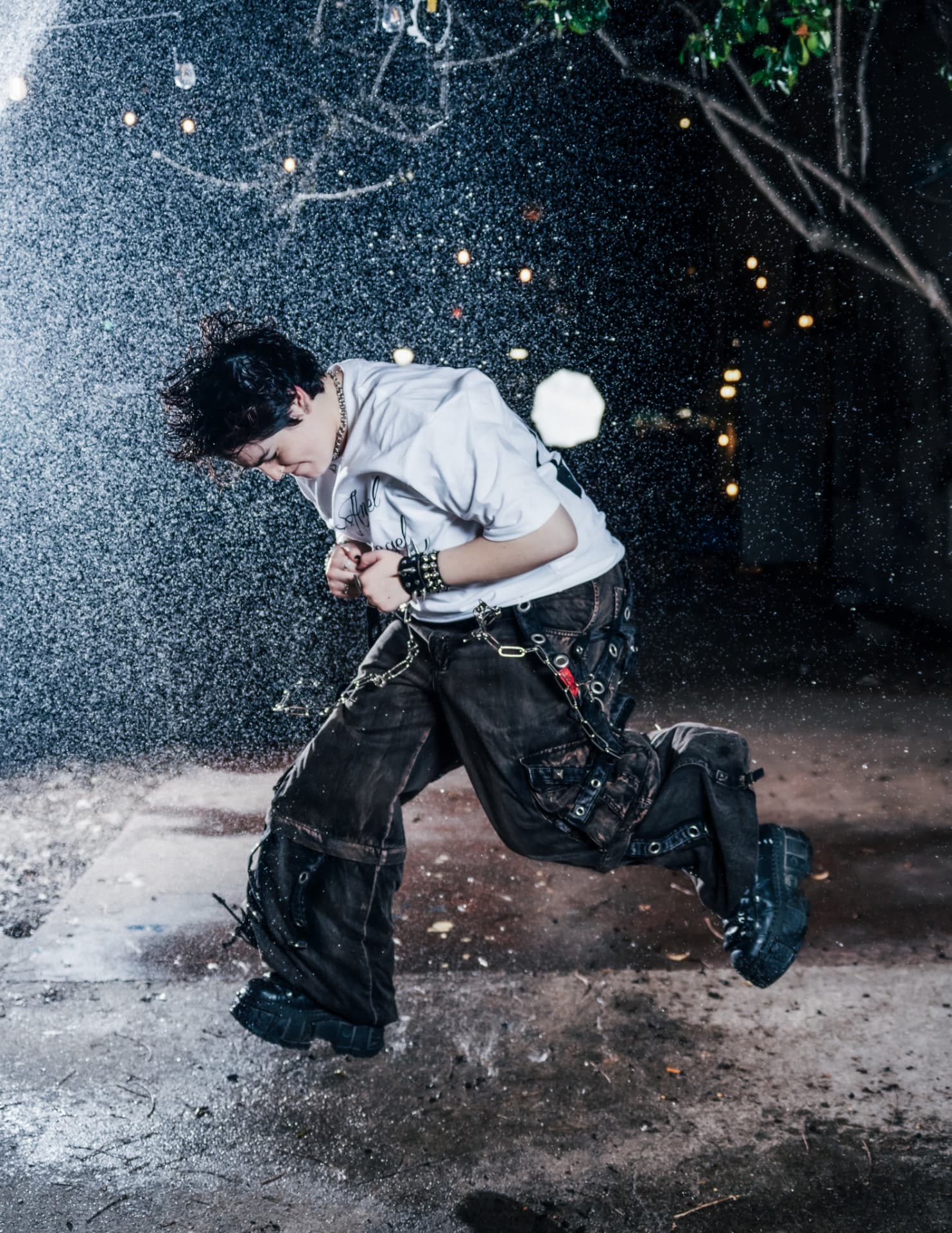 Modest Angel campaign, model leaping through water spray