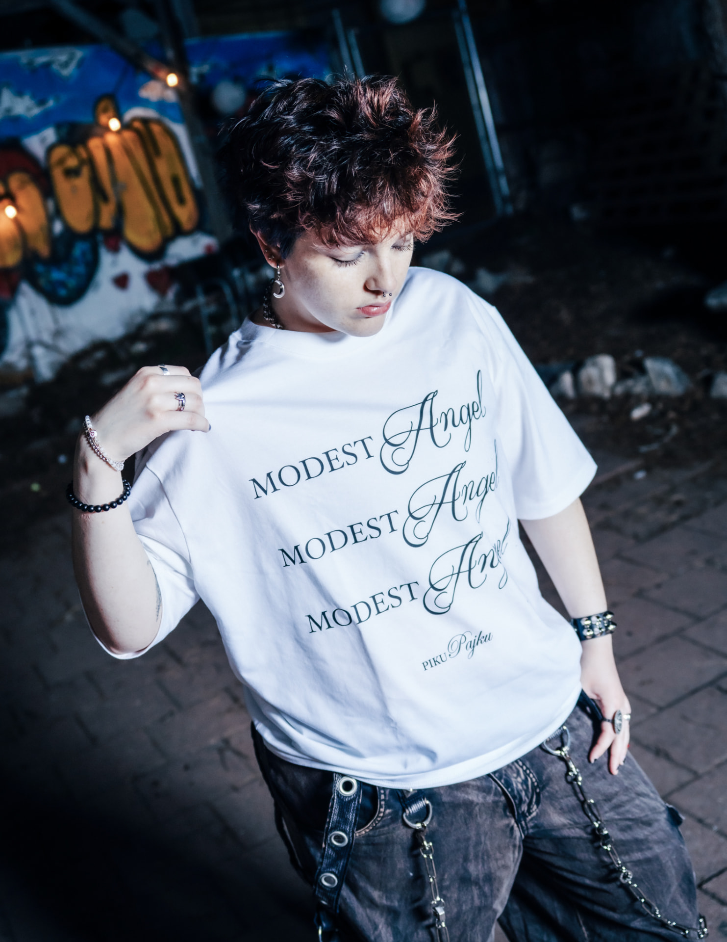 Modest Angel campaign, model holding the Modest Angel tee